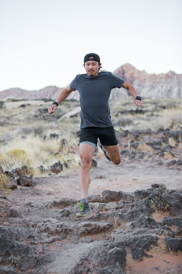 man trail running in mountains